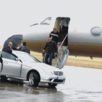 VIPs getting off a plane and into a waiting car driven by close protection officers
